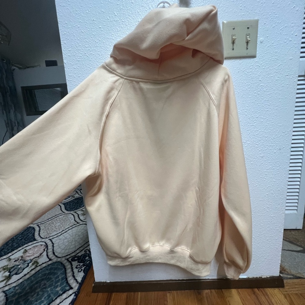 brand new essential hood cream color never been worn or used new with tags